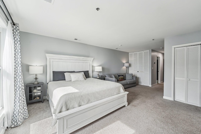 790 New River Inlet Rd Unit 113B, North Topsail Beach, NC 28460 - bedroom with light carpet, multiple closets, visible vents, and baseboards