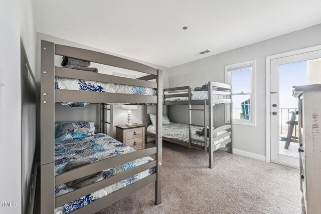 790 New River Inlet Rd Unit 113B, North Topsail Beach, NC 28460 - carpeted bedroom with baseboards and visible vents