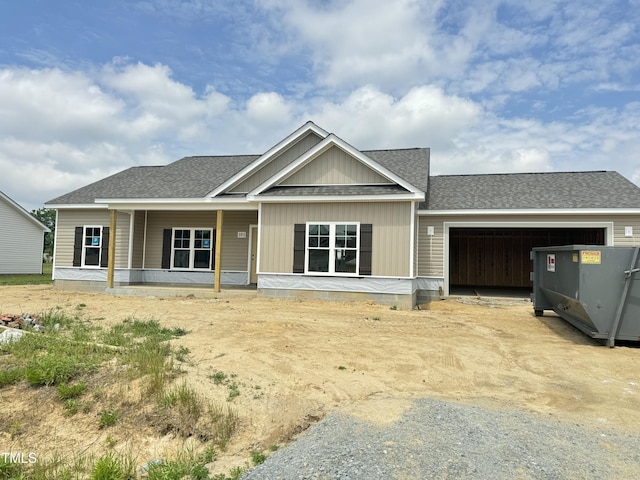 101 Waterstone Ct, Fremont, NC 27830 - view of front of house with an attached garage, a shingled roof, covered porch, and driveway
