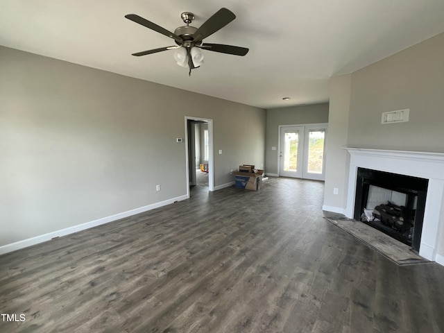 101 Waterstone Ct, Fremont, NC 27830 - unfurnished living room with dark wood-type flooring, a fireplace, a ceiling fan, and french doors