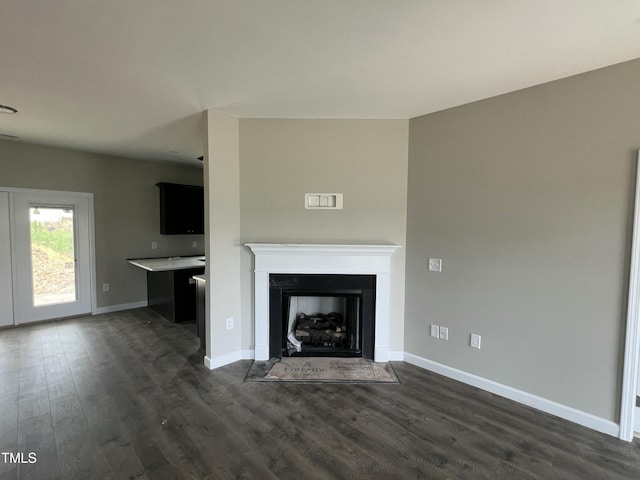 101 Waterstone Ct, Fremont, NC 27830 - unfurnished living room with dark wood-style floors and a fireplace with flush hearth
