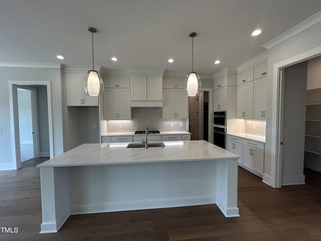 kitchen with backsplash, a spacious island, recessed lighting, dark wood-type flooring, and pendant lighting