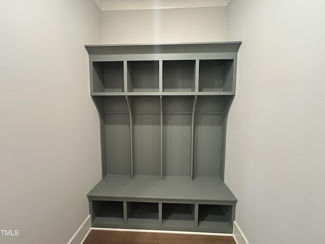 mudroom with baseboards and wood finished floors