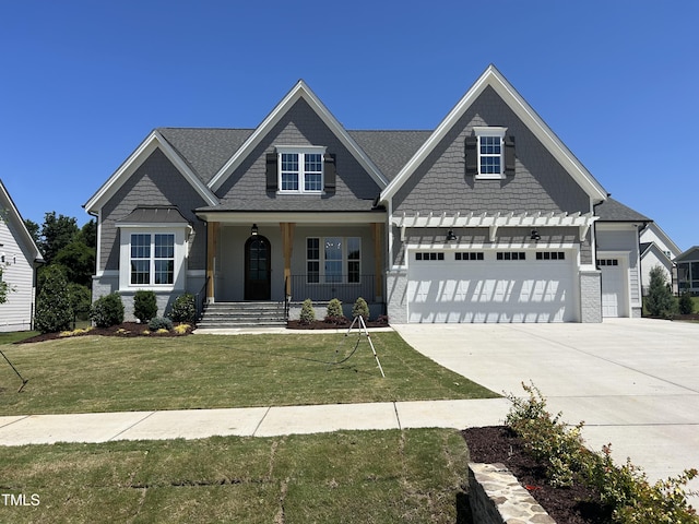921 Lily Claire Ln, Fuquay Varina, NC 27526 - craftsman-style house featuring covered porch, concrete driveway, and a front lawn