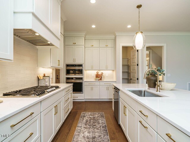 921 Lily Claire Ln, Fuquay Varina, NC 27526 - kitchen with stainless steel appliances, recessed lighting, light countertops, white cabinetry, and decorative backsplash