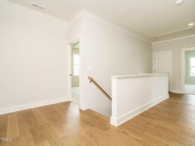 921 Lily Claire Ln, Fuquay Varina, NC 27526 - hall with attic access, an upstairs landing, light wood finished floors, and ornamental molding