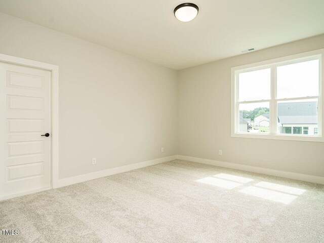 921 Lily Claire Ln, Fuquay Varina, NC 27526 - empty room with carpet floors and baseboards