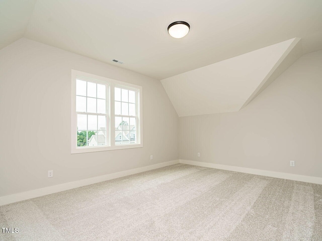 921 Lily Claire Ln, Fuquay Varina, NC 27526 - additional living space with lofted ceiling and carpet floors