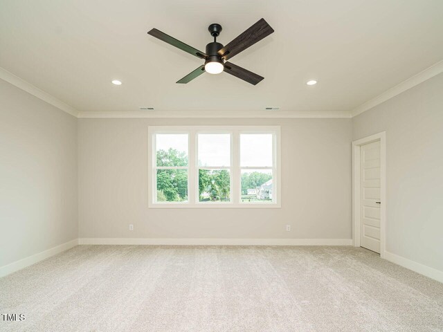 921 Lily Claire Ln, Fuquay Varina, NC 27526 - spare room featuring crown molding, ceiling fan, recessed lighting, and carpet floors