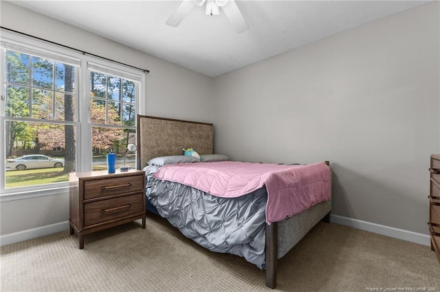 7783 Trappers Rd, Fayetteville, NC 28311 - bedroom with light carpet, baseboards, and a ceiling fan