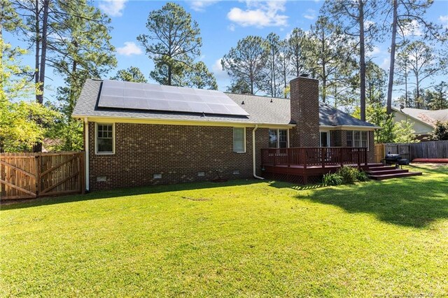7783 Trappers Rd, Fayetteville, NC 28311 - back of house featuring crawl space, a fenced backyard, a deck, and a lawn
