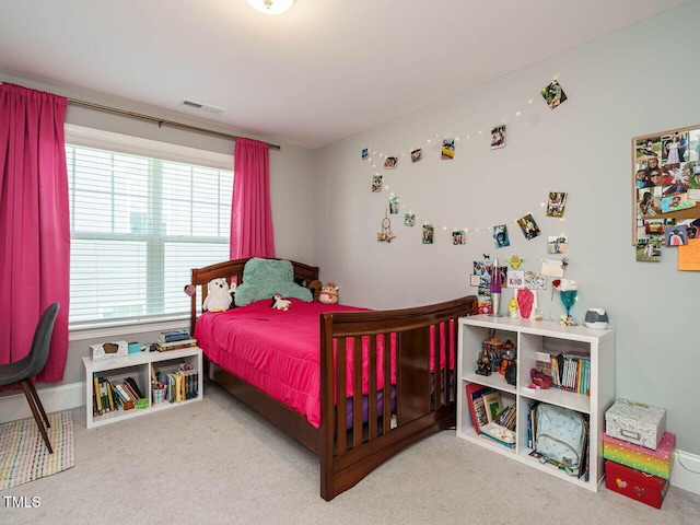 bedroom with carpet floors and baseboards