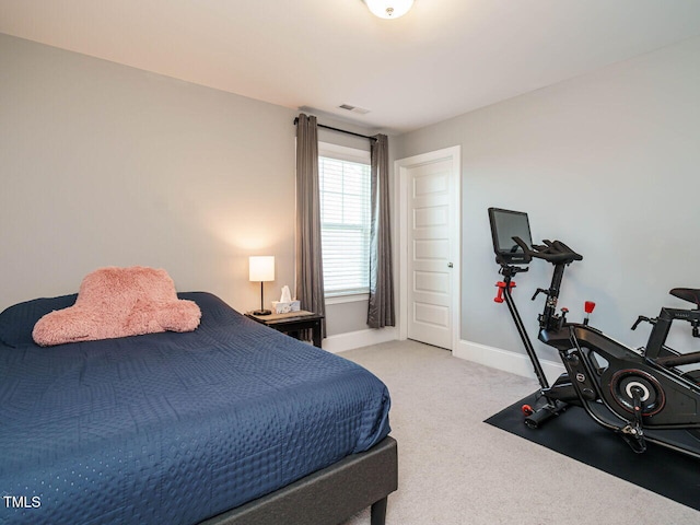 bedroom featuring carpet floors and baseboards
