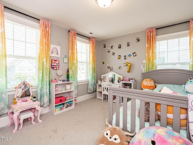 bedroom with carpet and baseboards