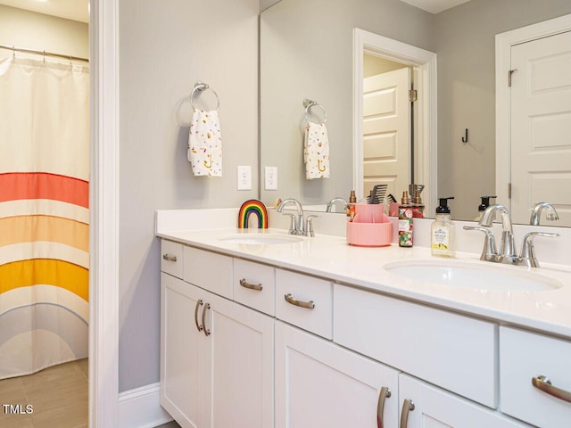 bathroom featuring double vanity