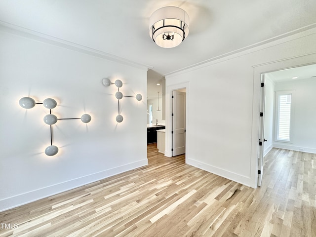 622 Glascock St, Raleigh, NC 27604 - spare room featuring crown molding and light wood finished floors