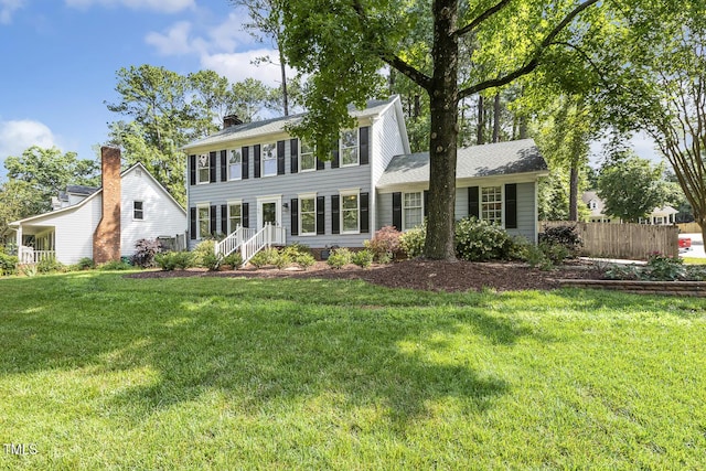 105 Cavendish Dr, Cary, NC 27513 - colonial-style house featuring a chimney
