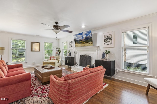 105 Cavendish Dr, Cary, NC 27513 - living room featuring baseboards, wood finished floors, crown molding, ceiling fan, and a brick fireplace
