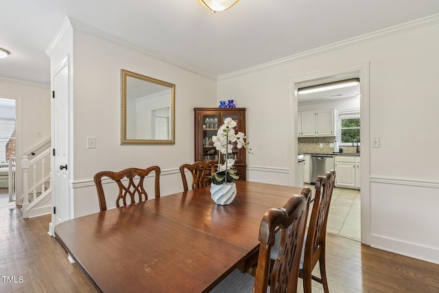 105 Cavendish Dr, Cary, NC 27513 - dining room with crown molding, light wood-style floors, and stairway