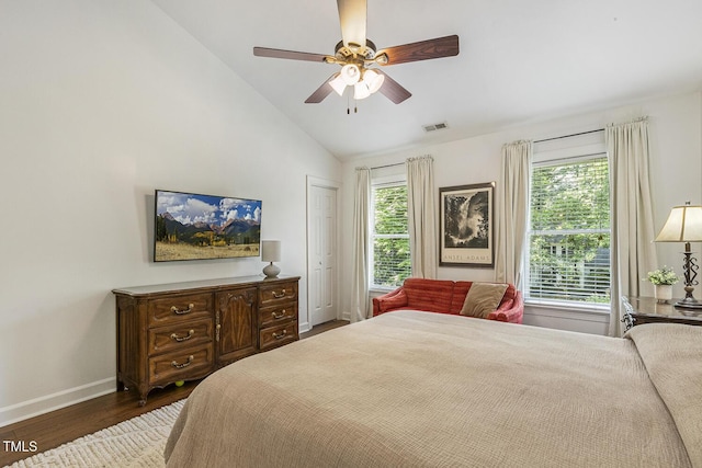 105 Cavendish Dr, Cary, NC 27513 - bedroom featuring wood finished floors, vaulted ceiling, multiple windows, baseboards, and a ceiling fan