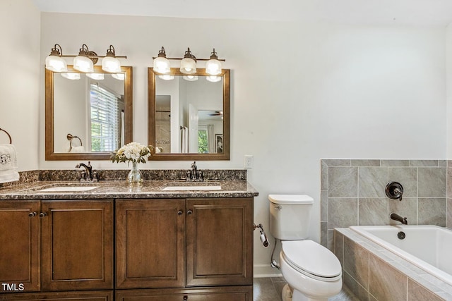 105 Cavendish Dr, Cary, NC 27513 - bathroom featuring a bath, double vanity, toilet, baseboards, and tile patterned floors