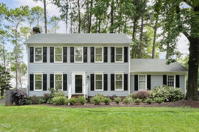 105 Cavendish Dr, Cary, NC 27513 - colonial inspired home with a chimney, a front yard, and roof with shingles