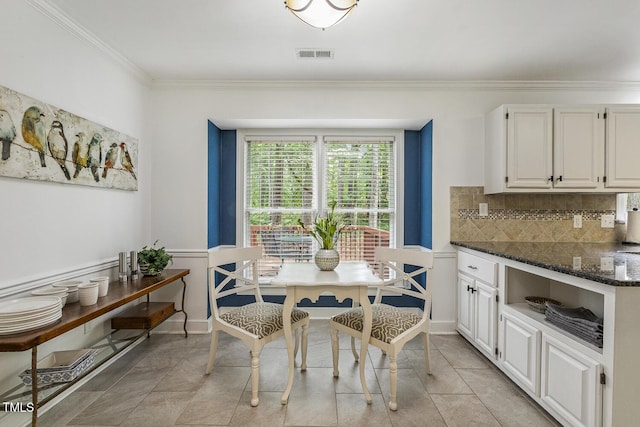 105 Cavendish Dr, Cary, NC 27513 - dining area featuring crown molding, light tile patterned floors, and baseboards