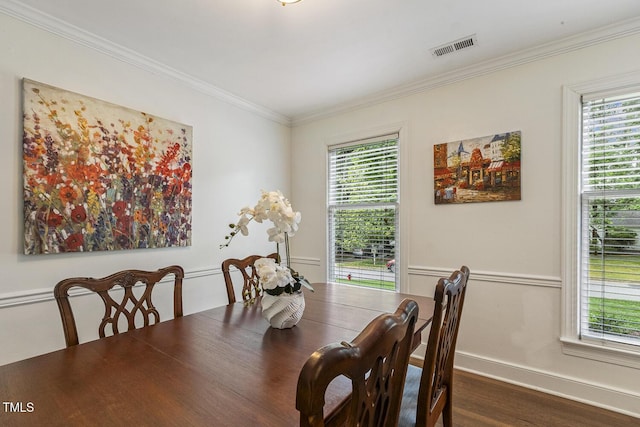 105 Cavendish Dr, Cary, NC 27513 - dining room featuring plenty of natural light, crown molding, dark wood-style floors, and baseboards