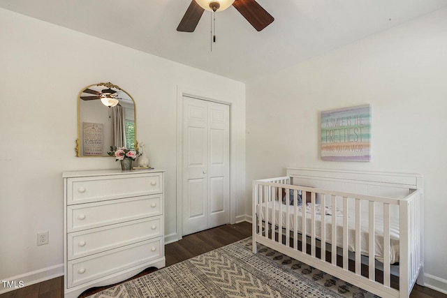 105 Cavendish Dr, Cary, NC 27513 - bedroom featuring dark wood-type flooring, baseboards, a nursery area, a closet, and a ceiling fan