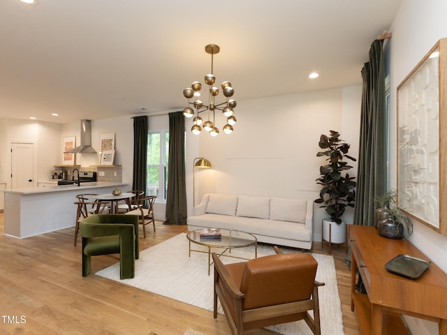 612 E Ellerbee St, Durham, NC 27704 - living room with light wood-style flooring, recessed lighting, and a chandelier