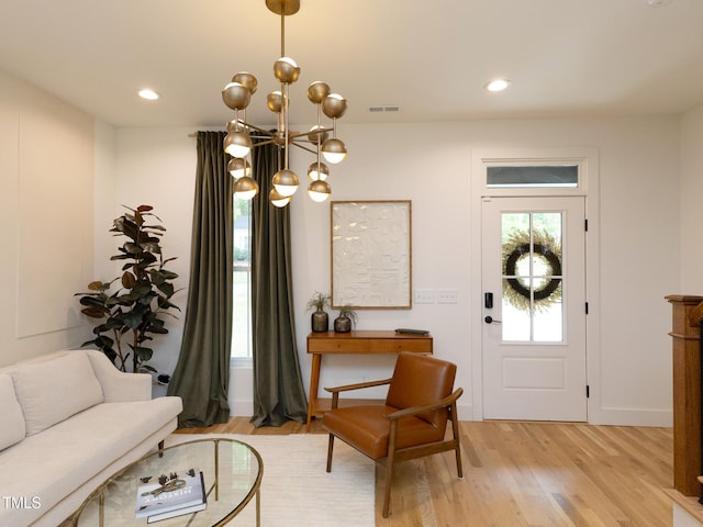 612 E Ellerbee St, Durham, NC 27704 - foyer featuring a chandelier, light wood finished floors, and recessed lighting