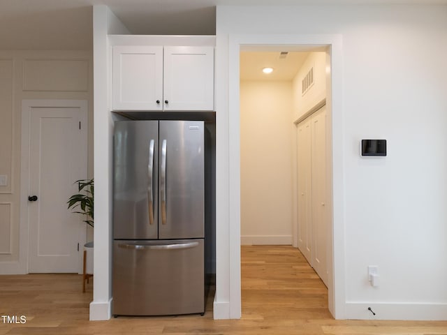 612 E Ellerbee St, Durham, NC 27704 - kitchen with freestanding refrigerator, white cabinetry, light wood-style flooring, baseboards, and recessed lighting