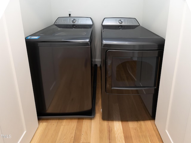 612 E Ellerbee St, Durham, NC 27704 - clothes washing area featuring washer and dryer and light wood finished floors