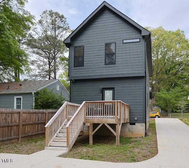 612 E Ellerbee St, Durham, NC 27704 - back of property featuring fence, stairs, and a wooden deck