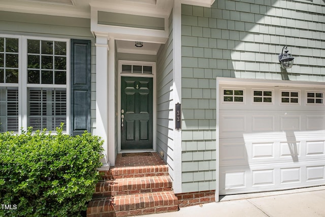doorway to property featuring a garage