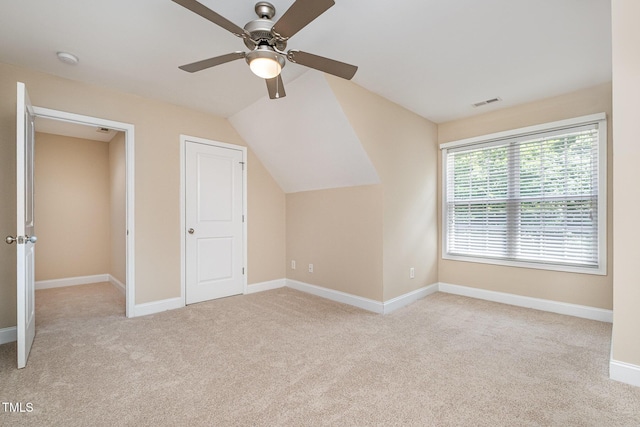 bonus room featuring carpet flooring, ceiling fan, vaulted ceiling, and baseboards