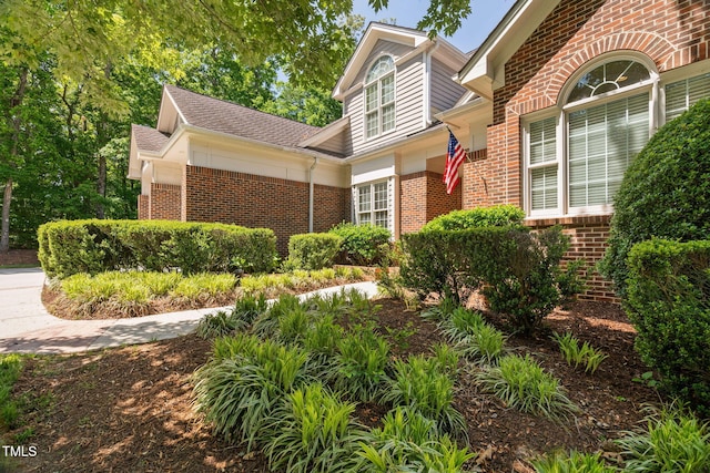 exterior space with brick siding