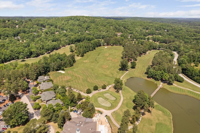 aerial view featuring a water view, view of golf course, and a wooded view
