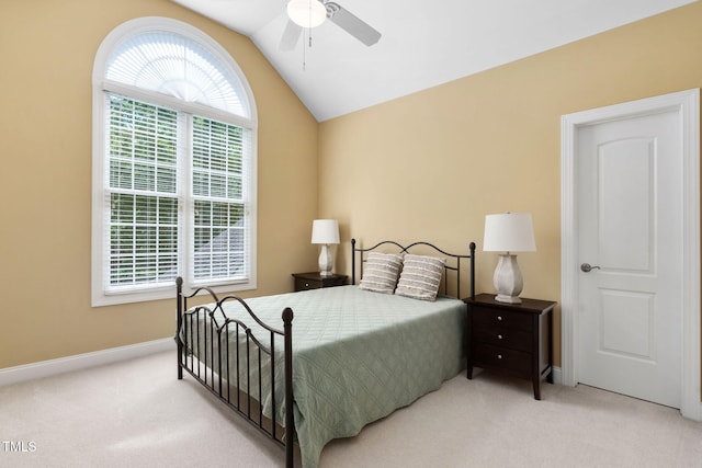 carpeted bedroom featuring a ceiling fan, baseboards, and lofted ceiling
