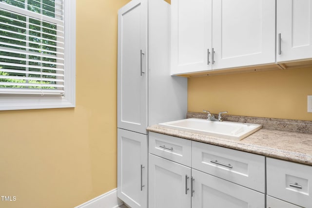 laundry room featuring a sink and plenty of natural light