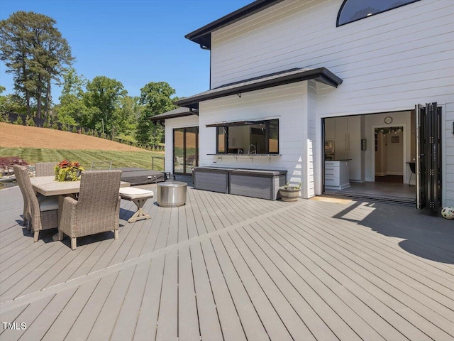 wooden deck featuring outdoor dining space