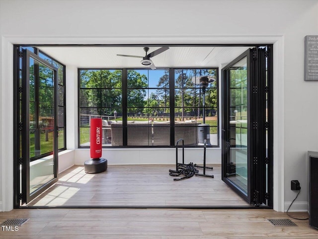 interior space with visible vents and wood finished floors