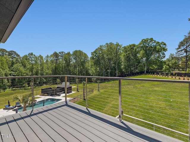 wooden deck with a yard and an outdoor pool
