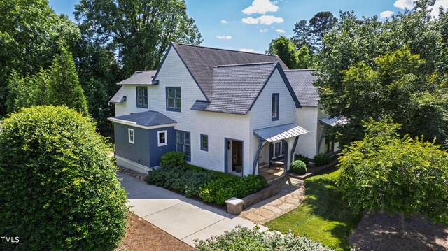 523 Vick Ave, Raleigh, NC 27612 - view of front of house featuring roof with shingles