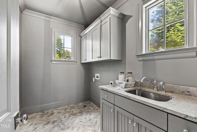 523 Vick Ave, Raleigh, NC 27612 - laundry area with hookup for an electric dryer, brick floors, cabinet space, crown molding, and hookup for a washing machine