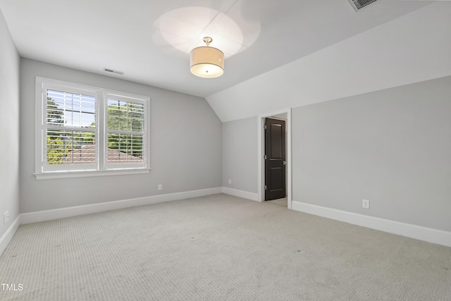 523 Vick Ave, Raleigh, NC 27612 - bonus room featuring baseboards, light carpet, and lofted ceiling