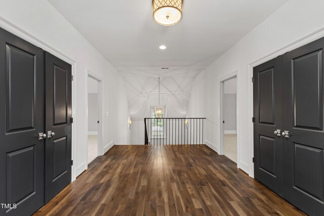 523 Vick Ave, Raleigh, NC 27612 - hall featuring dark wood-type flooring, a chandelier, recessed lighting, and baseboards
