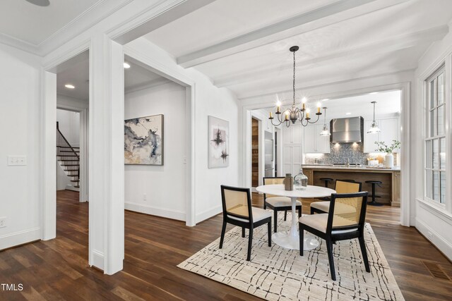 523 Vick Ave, Raleigh, NC 27612 - dining space with a chandelier, baseboards, stairs, dark wood finished floors, and crown molding