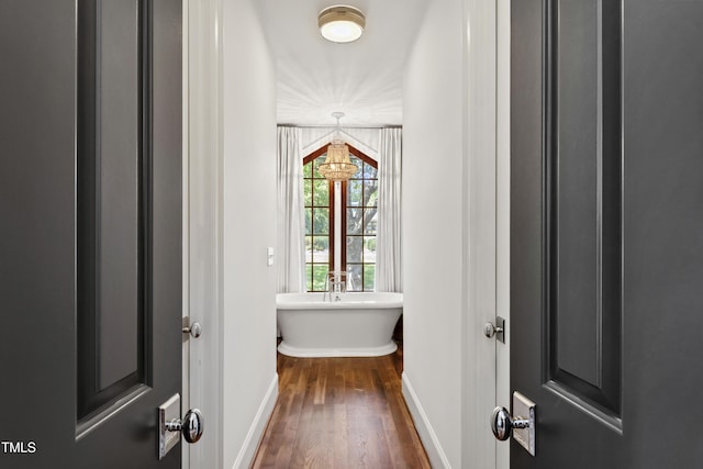 523 Vick Ave, Raleigh, NC 27612 - corridor with dark wood finished floors and baseboards