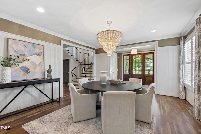 523 Vick Ave, Raleigh, NC 27612 - dining area with stairs, a decorative wall, plenty of natural light, wood finished floors, and crown molding